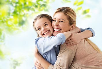 Image showing happy smiling mother hugging daughter