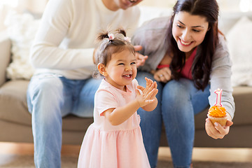 Image showing baby girl with parents at home birthday party