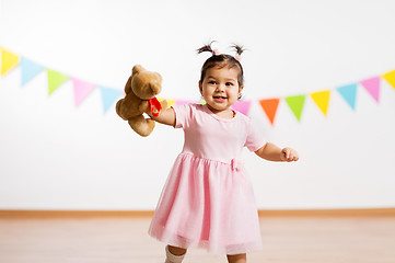 Image showing happy baby girl with teddy bear on birthday party