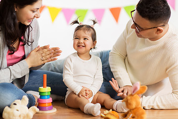 Image showing baby girl with parents clapping hands