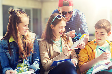 Image showing group of students with notebooks at school yard