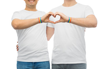 Image showing couple with gay pride rainbow wristbands and heart