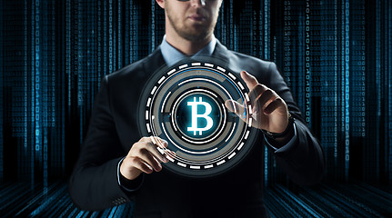 Image showing close up of businessman with bitcoin hologram