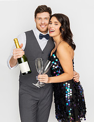 Image showing happy couple with champagne and glasses at party