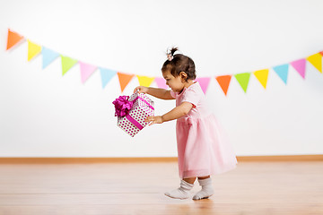 Image showing happy baby girl with gift box on birthday party