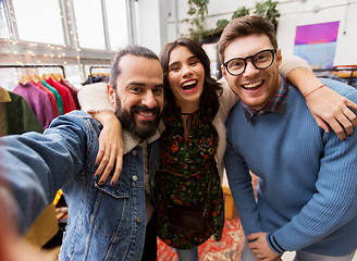 Image showing friends taking selfie at vintage clothing store