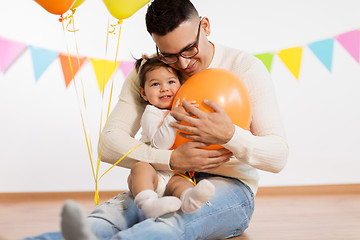 Image showing father and daughter with birthday party balloons