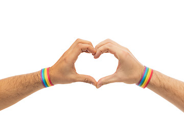 Image showing male hands with gay pride wristbands showing heart