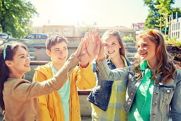 Image showing happy students or friends making high five