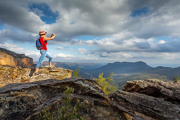 Image showing Tourist taking photos of stunning Blue Mountain vistas