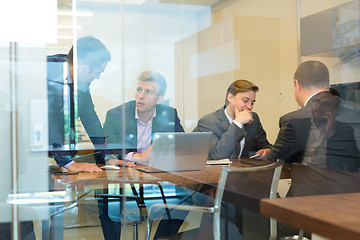 Image showing Business people sitting and brainstorming at corporate meeting.