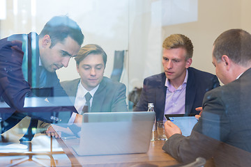 Image showing Business people sitting and brainstorming at corporate meeting.