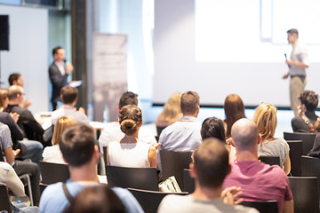 Image showing Business speaker giving a talk at business conference event.