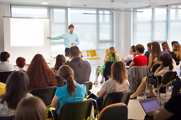 Image showing Speaker giving presentation on business conference.