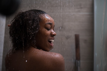 Image showing African American woman in the shower