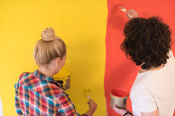 Image showing couple painting interior wall