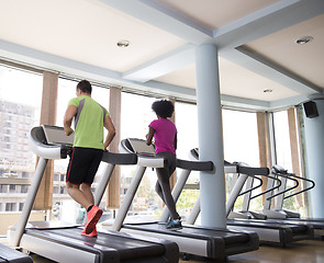 Image showing people exercisinng a cardio on treadmill in gym