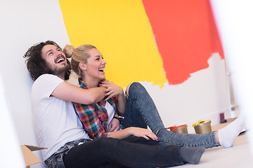 Image showing Happy young couple relaxing after painting