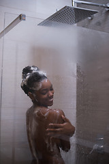 Image showing African American woman in the shower