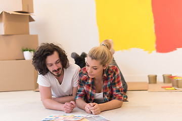 Image showing Happy young couple relaxing after painting