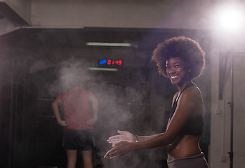 Image showing black woman preparing for climbing workout