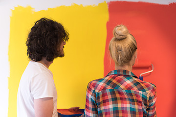 Image showing couple painting interior wall