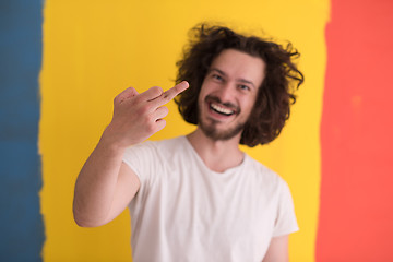 Image showing young man with funny hair over color background