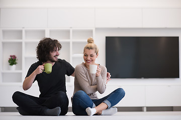 Image showing young couple in their new home