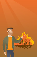Image showing Man standing on the background of wildfire.