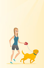 Image showing Young woman walking with her dog.