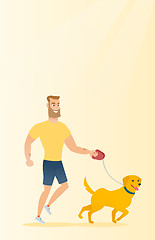 Image showing Young man walking with his dog.