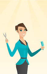 Image showing Hairdresser holding comb and scissors in hands.