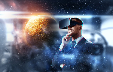 Image showing businessman in virtual reality headset over space