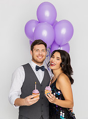 Image showing happy couple with balloons and cupcakes at party