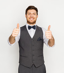 Image showing happy man in festive suit showing thumbs up