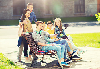 Image showing happy teenage students taking selfie by smartphone