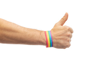 Image showing hand with gay pride rainbow wristband shows thumb