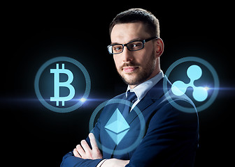 Image showing buisnessman with cryptocurrency icons