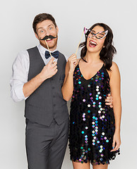 Image showing happy couple with party props having fun