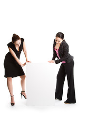 Image showing Businesswomen with billboard