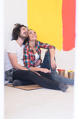 Image showing Happy young couple relaxing after painting