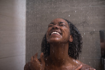 Image showing African American woman in the shower