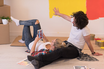 Image showing Happy young couple relaxing after painting