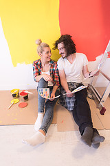 Image showing Happy young couple relaxing after painting