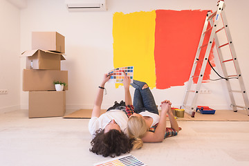 Image showing Happy young couple relaxing after painting