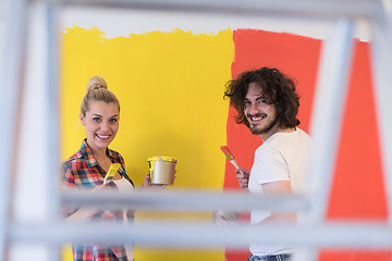 Image showing couple painting interior wall