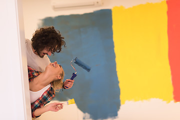 Image showing portrait of a couple painting interior wall