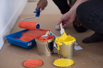 Image showing painters prepare color for painting