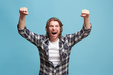 Image showing Winning success man happy ecstatic celebrating being a winner. Dynamic energetic image of male model