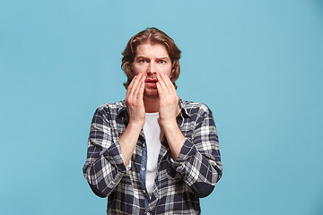 Image showing Portrait of the scared man on pink